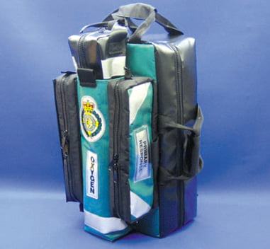Oxygen Pack EMS (EMS/OP/2007) Manufactured in heavy duty wipe clean material. This pack has detachable top and side skid sheets, top and side grab handles with torch attachment and a full foldaway backpack. The front has twin opening pouches with elasticated mesh pouches and a removable CD oxygen insert with safety strap. The inside has a collar and document centre pouch, detachable zip opening colour coded windowed pouches (4 x medium, 1 x large) and 1 x detachable AED pouch. This makes a robust, compact Primary Response Pack. Size: 58(H) x 28(W) x 33(D) £198